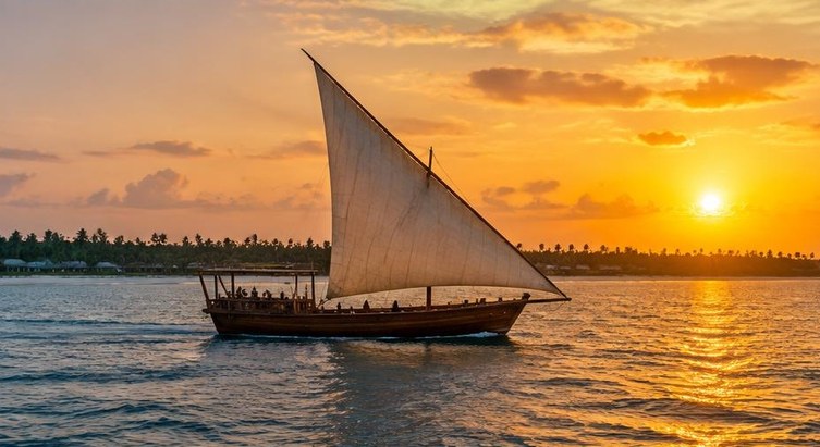 Traditional dhow sailing at sunset off Zanzibar